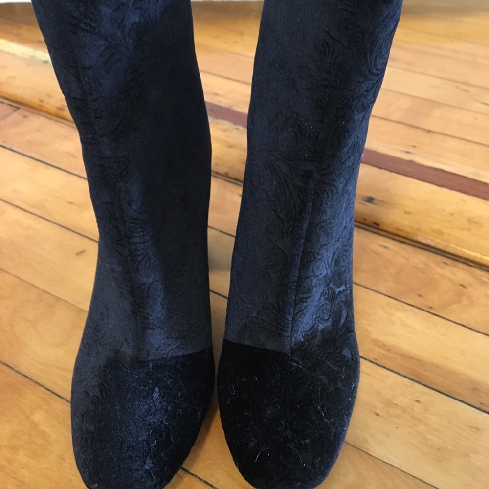Block heel velvet booties with a floral pattern.